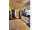 Updated kitchen boasts white cabinets, stainless fridge, black countertops, and stylish tile flooring at 134 Gulfview Rd, Punta Gorda, FL 33950