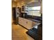 Updated kitchen features stainless steel appliances and granite countertops at 134 Gulfview Rd, Punta Gorda, FL 33950
