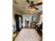 A cozy room with ceiling fan and wood-look flooring that offers versatile space at 134 Gulfview Rd, Punta Gorda, FL 33950