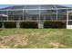 Enclosed pool area showcasing the private outdoor space with manicured bushes for additional privacy at 134 Gulfview Rd, Punta Gorda, FL 33950