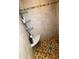 Walk-in shower featuring tiled walls, a corner seat, and convenient storage at 134 Gulfview Rd, Punta Gorda, FL 33950