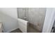 Modern bathroom featuring glass-enclosed shower with tiled walls and flooring at 15127 Oxford Grey Dr, Bradenton, FL 34211