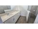 Bathroom featuring double sink vanity, quartz countertop, and glass-enclosed shower at 15127 Oxford Grey Dr, Bradenton, FL 34211