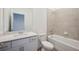 Bathroom featuring a single vanity, toilet, and tiled tub-shower combo at 15127 Oxford Grey Dr, Bradenton, FL 34211