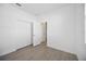 Neutral bedroom offering a closet with double doors and light colored flooring at 15127 Oxford Grey Dr, Bradenton, FL 34211