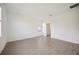 Empty bedroom with wood-look tile flooring and window offering natural light at 15127 Oxford Grey Dr, Bradenton, FL 34211