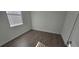 This bedroom features wood-look flooring and a bright window for natural light at 15127 Oxford Grey Dr, Bradenton, FL 34211