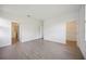Spacious bedroom with wood-look tile flooring and doorways to closet and bathroom at 15127 Oxford Grey Dr, Bradenton, FL 34211