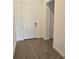 Inviting entryway featuring wood-look tile flooring, leading to other areas of the home at 15127 Oxford Grey Dr, Bradenton, FL 34211