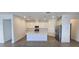 Bright kitchen featuring an island with modern appliances and countertops, and ample cabinet space at 15127 Oxford Grey Dr, Bradenton, FL 34211