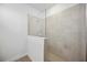 Tiled shower with glass partition and shower head at 15127 Oxford Grey Dr, Bradenton, FL 34211