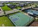 Aerial view of the basketball court with other sports courts, in a lovely neighborhood at 17737 Savory Mist Cir, Bradenton, FL 34211