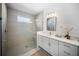 Bright bathroom featuring a glass-enclosed shower and modern vanity with countertop at 17737 Savory Mist Cir, Bradenton, FL 34211