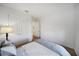 Bright bedroom features a comfortable bed, and a closet with double doors at 17737 Savory Mist Cir, Bradenton, FL 34211