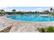 Expansive community pool with ample deck space, lounge chairs, and clear blue water at 17737 Savory Mist Cir, Bradenton, FL 34211