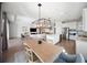Open-concept dining and living area with natural light and modern decor at 17737 Savory Mist Cir, Bradenton, FL 34211