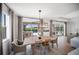 Dining area overlooking the outdoor patio and pool area at 17737 Savory Mist Cir, Bradenton, FL 34211