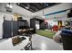 Spacious garage includes golf simulator, workspace, and storage at 17737 Savory Mist Cir, Bradenton, FL 34211