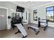 Gym with weight-lifting equipment and a mirrored wall at 17737 Savory Mist Cir, Bradenton, FL 34211