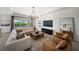 Bright and airy living room featuring a modern light fixture, and comfortable furniture at 17737 Savory Mist Cir, Bradenton, FL 34211