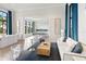 Clubhouse lounge with modern furnishings and an open layout that connects to a kitchen space at 17737 Savory Mist Cir, Bradenton, FL 34211