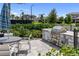 Outdoor grill with stone surround and seating area for community residents at 17737 Savory Mist Cir, Bradenton, FL 34211