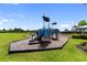 Colorful community playground with slides, climbing structures, and a wood chip safety surface at 17737 Savory Mist Cir, Bradenton, FL 34211