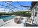 Inviting screened-in pool and patio area with comfortable outdoor seating at 17737 Savory Mist Cir, Bradenton, FL 34211