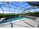 Beautiful screened-in pool with lush landscaping providing privacy at 17737 Savory Mist Cir, Bradenton, FL 34211