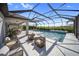 Stunning pool with sun loungers and outdoor seating area at 17737 Savory Mist Cir, Bradenton, FL 34211