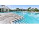 Resort-style community pool with plenty of lounge seating and a covered area for shade at 17737 Savory Mist Cir, Bradenton, FL 34211