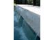 Water falling into a pool from a decorative waterfall feature at 17737 Savory Mist Cir, Bradenton, FL 34211