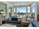 Inviting poolside lounge area with comfortable seating, ceiling fans, and views of the sparkling pool at 17737 Savory Mist Cir, Bradenton, FL 34211