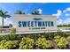 Entrance to Sweetwater at Lakewood Ranch community sign surrounded by lush landscaping at 17737 Savory Mist Cir, Bradenton, FL 34211