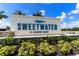 Community entrance sign for Sweetwater at Lakewood Ranch with landscaped surroundings at 17737 Savory Mist Cir, Bradenton, FL 34211