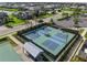 Aerial view of tennis courts in a well-maintained community with people playing at 17737 Savory Mist Cir, Bradenton, FL 34211