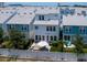 Aerial view of a backyard featuring a patio with outdoor seating, a grill, and well-maintained landscaping at 2217 Muesel St, Sarasota, FL 34237