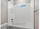 Clean and bright bathroom features a tiled shower and a bathtub with chrome fixtures at 2217 Muesel St, Sarasota, FL 34237