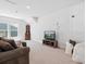 Upstairs bonus room with TV and comfortable sofa, perfect for relaxing or entertaining at 2217 Muesel St, Sarasota, FL 34237
