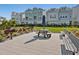 Outdoor picnic area with tables, benches, and barbecue grills, surrounded by well-kept lawns at 2217 Muesel St, Sarasota, FL 34237