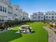 Community green space with manicured lawns, picnic tables, and nearby residences at 2217 Muesel St, Sarasota, FL 34237