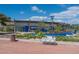 Modern community center showcasing a blue facade with vibrant murals, surrounded by lush landscaping at 2217 Muesel St, Sarasota, FL 34237