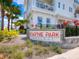 Stylish building entrance at Payne Park Village, framed by lush landscaping at 2217 Muesel St, Sarasota, FL 34237