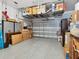 Spacious garage with epoxy flooring and overhead storage racks for organization at 2217 Muesel St, Sarasota, FL 34237