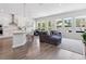 Bright open-concept living space with hardwood floors, modern furnishings, and abundant natural light at 2217 Muesel St, Sarasota, FL 34237