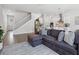 Bright, open-concept living room featuring modern decor, hardwood floors, and a staircase at 2217 Muesel St, Sarasota, FL 34237
