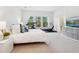 Well-lit main bedroom with a modern design, includes a television and exercise equipment at 2217 Muesel St, Sarasota, FL 34237