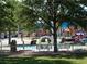 Playground area with animal statues and playground equipment set among trees and green space at 2217 Muesel St, Sarasota, FL 34237