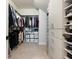 Spacious walk-in closet featuring custom shelving and ample storage space for clothes and accessories at 2217 Muesel St, Sarasota, FL 34237