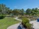 Green park with a scenic walking path, mature trees, lush grass, and landscaping at 2217 Muesel St, Sarasota, FL 34237